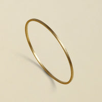Handcrafted bronze bangle with a gold coating