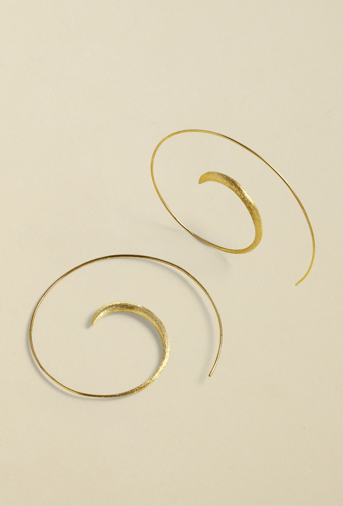 Close-up of Gold-Coated Handmade Silver Creoles