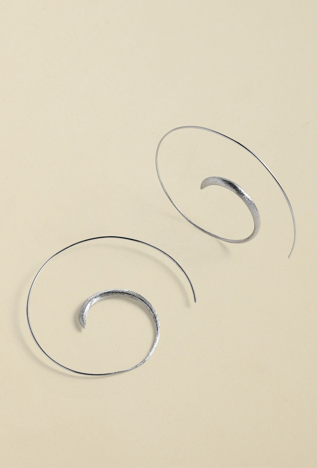 Close-up of Handmade Silver Creoles