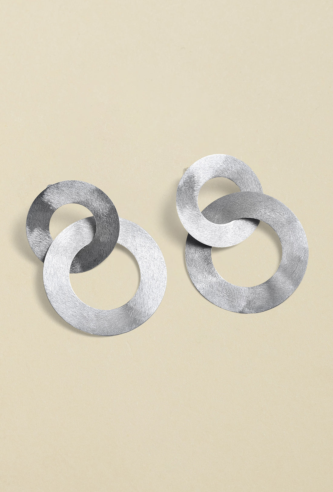 Close-up of silver coated handmade bronze Earrings showcasing intricate craftsmanship and elegant design
