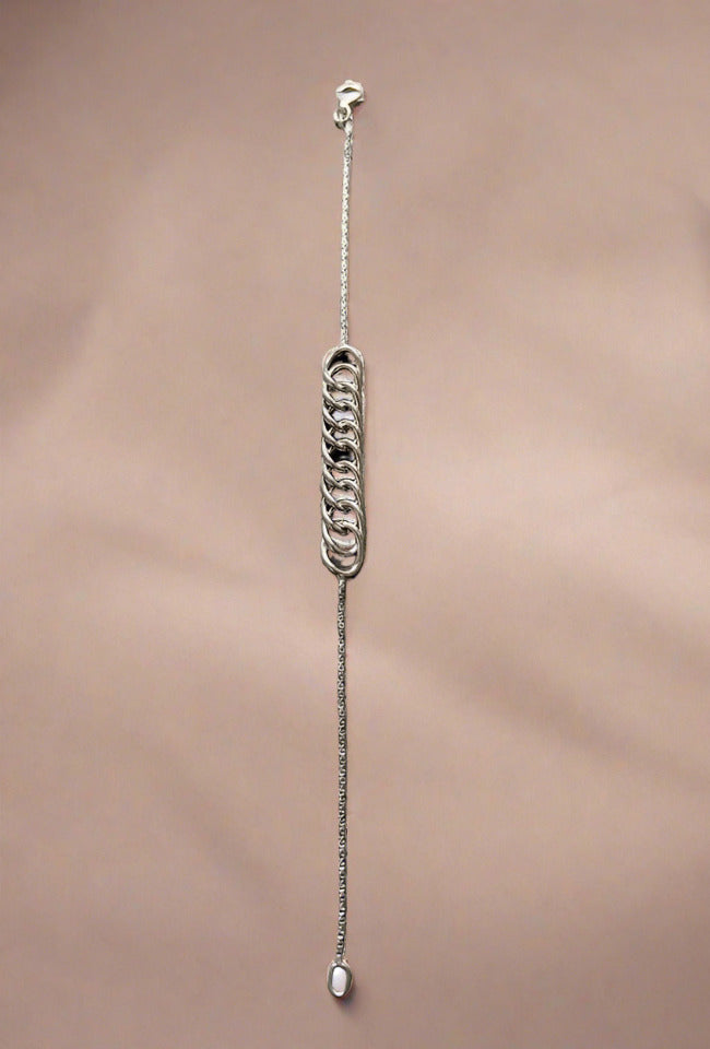 Close-up of a sterling silver chain bracelet, featuring a simple and elegant design with a lightweight feel, perfect for everyday wear