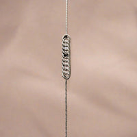 Close-up of a sterling silver chain bracelet, featuring a simple and elegant design with a lightweight feel, perfect for everyday wear