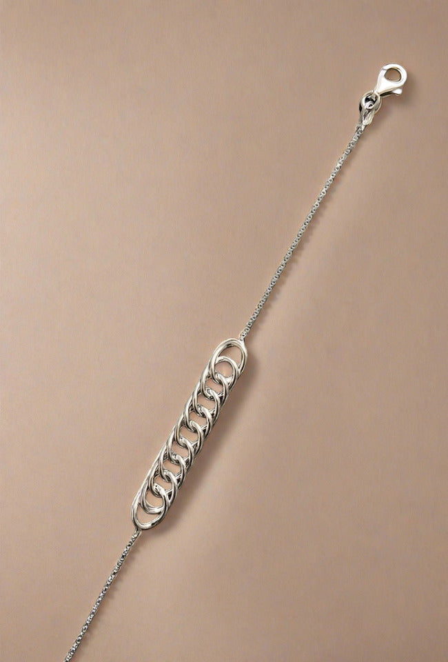 Close-up of a sterling silver chain bracelet, featuring a simple and elegant design with a lightweight feel, perfect for everyday wear