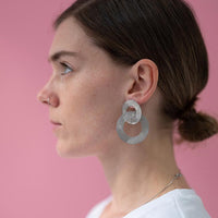 Close-up of a woman with wearing silver Coated Handmade Bronze Earrings