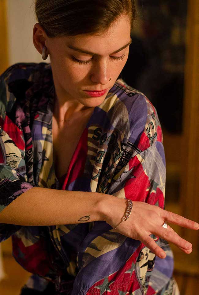 Close-up of a woman's wrist adorned with a sterling silver chain bracelet