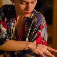 Close-up of a woman's wrist adorned with a sterling silver chain bracelet