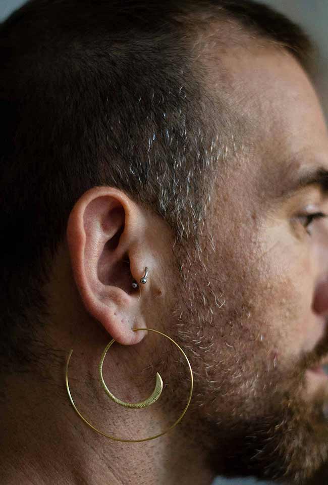 Close-up of Gold-Coated Handmade Silver Creoles Adorning a Bearded Men's Ear