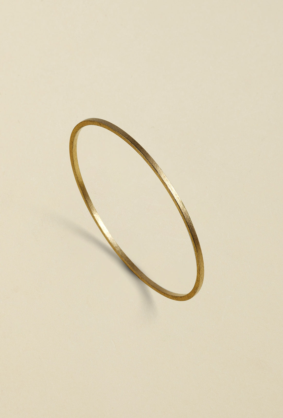 Handcrafted bronze bangle with a gold coating