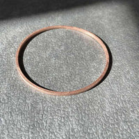Handcrafted bronze bangle with a bronze coloring