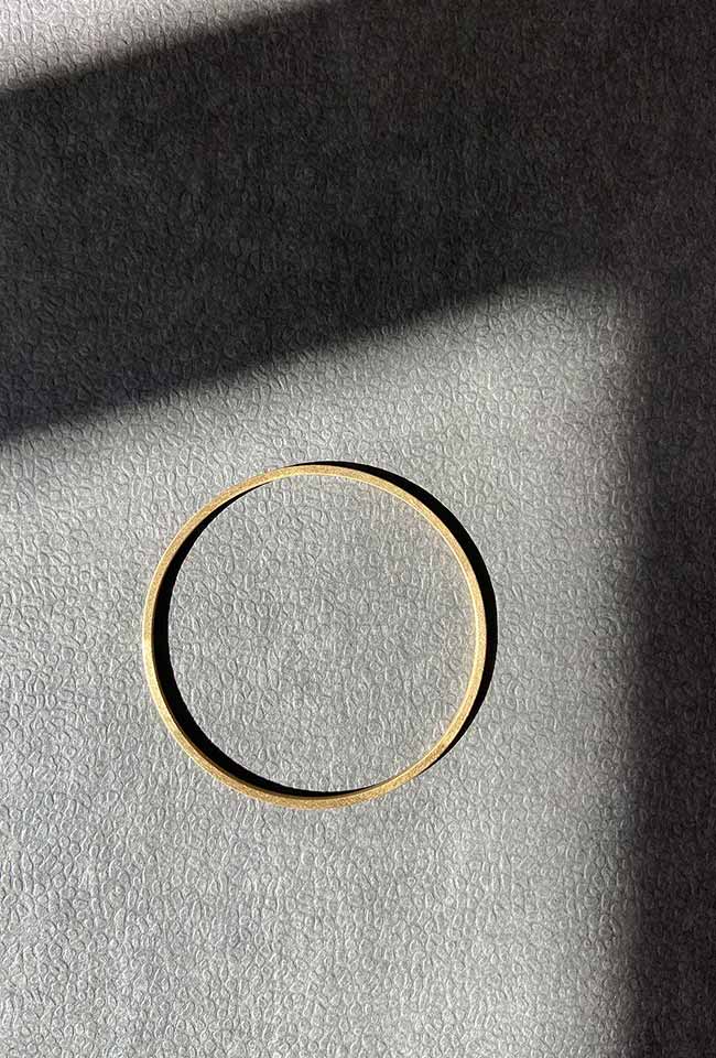 Handcrafted bronze bangle with a gold coating